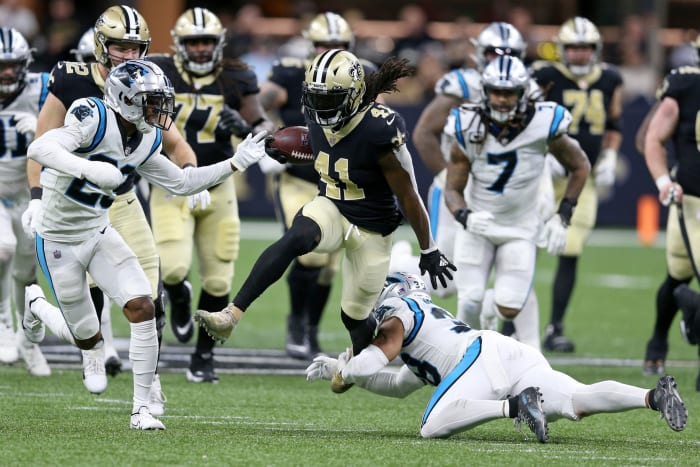 Jan 2, 2022; New Orleans Saints running back Alvin Kamara (41) runs through the Carolina Panthers. Mandatory Credit: Chuck Cook-USA TODAY Sports